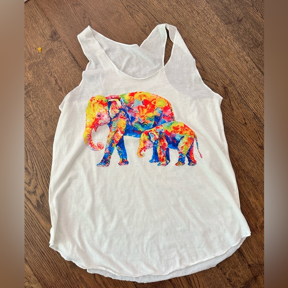 Small/medium tank top with colorful elephants worn only twice. No brand /tag